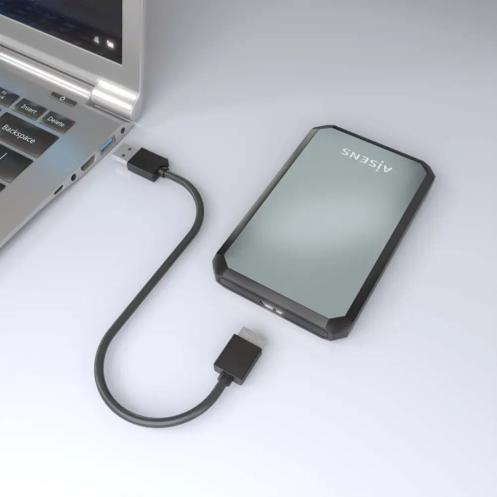 Carcasa para disco duro externo AISENS ASE-2529B en negro y gris, compatible con SSD y discos de 2.5 pulgadas.