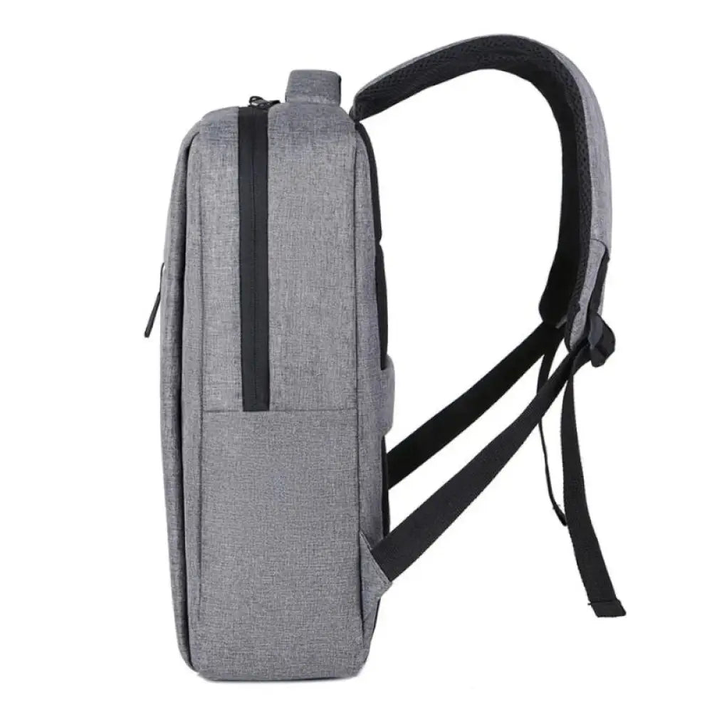 Mochila profesional NILOX gris para portátil de 15.6 pulgadas, con compartimentos y diseño resistente para transporte seguro.