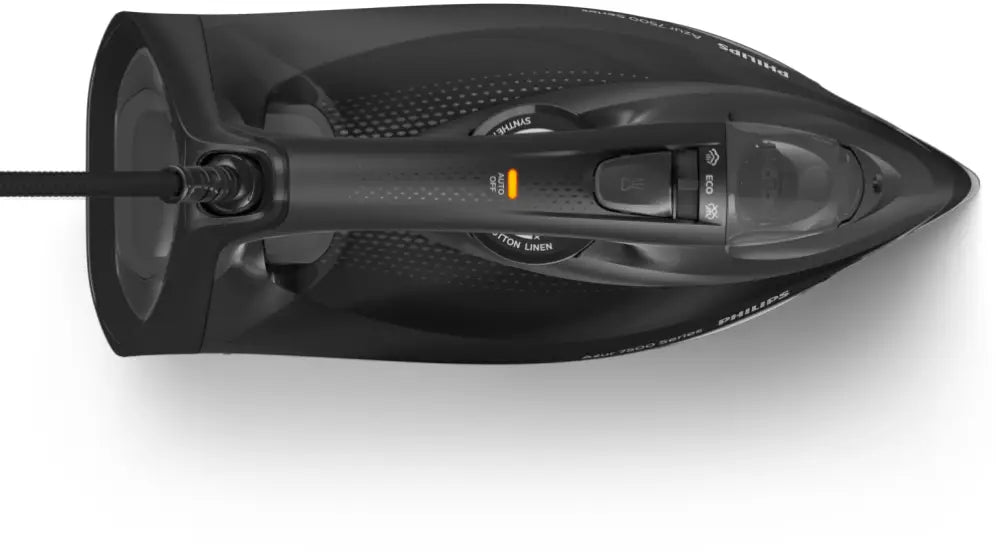 Plancha de vapor Philips 7500 Series DST7511/80 de color negro sobre tabla, con base antiadherente y control ajustable.