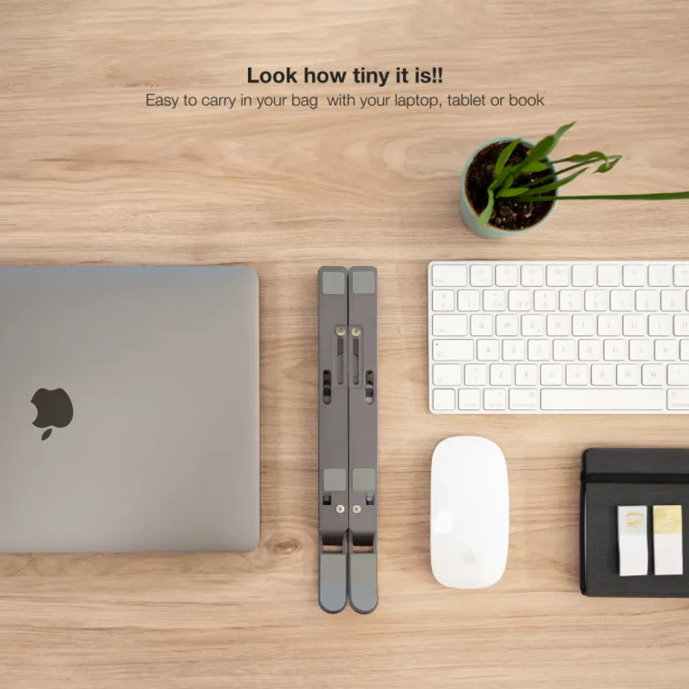 Soporte elevador gris TOOQ para portátiles, tablets, móviles y libros, con diseño estable y ajustable para comodidad.